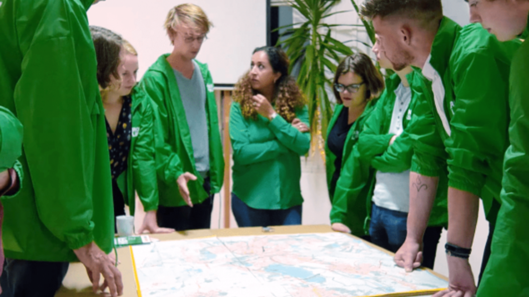 Volunteers around a table with a map